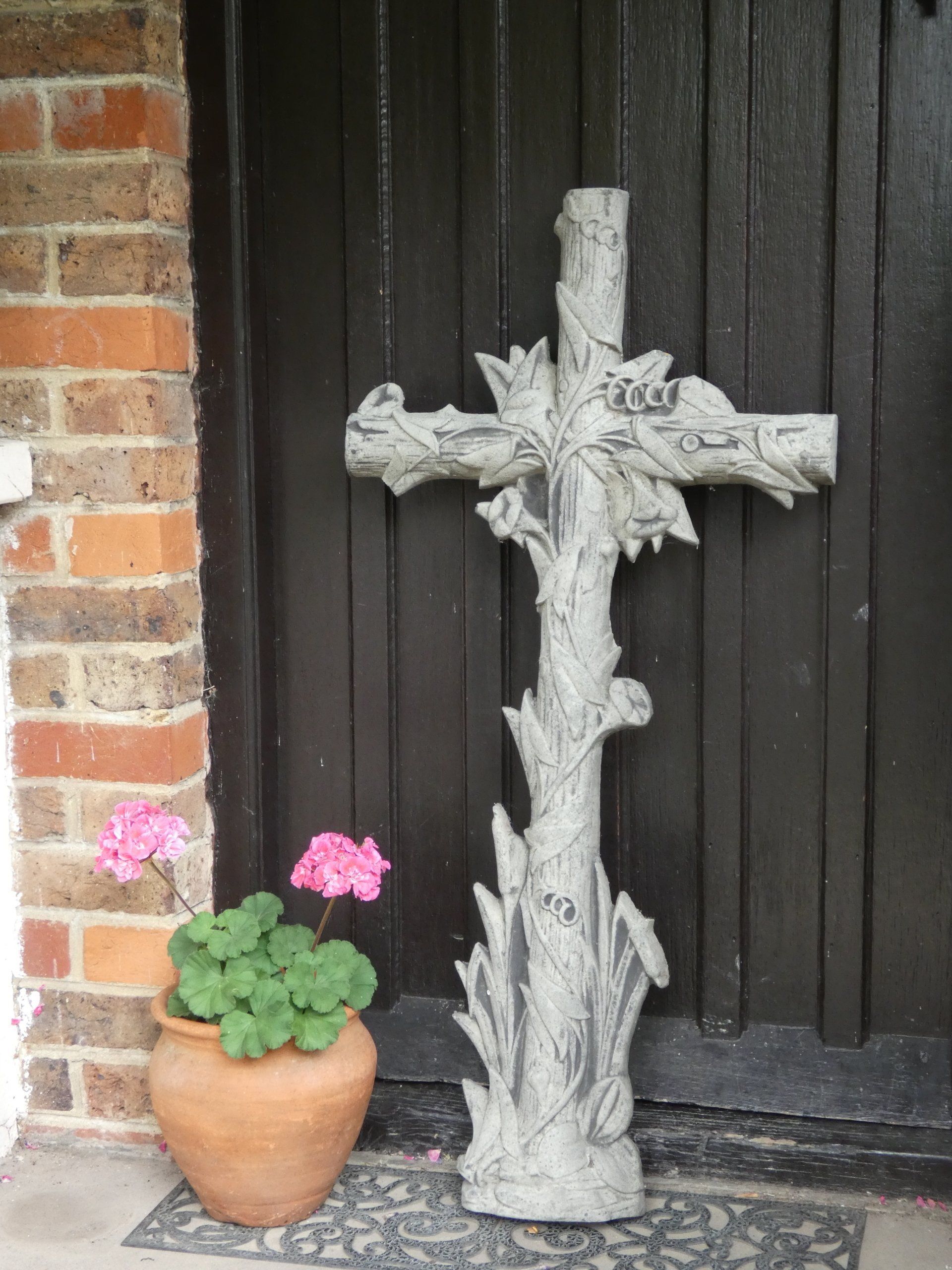 ornate cross stone garden statue