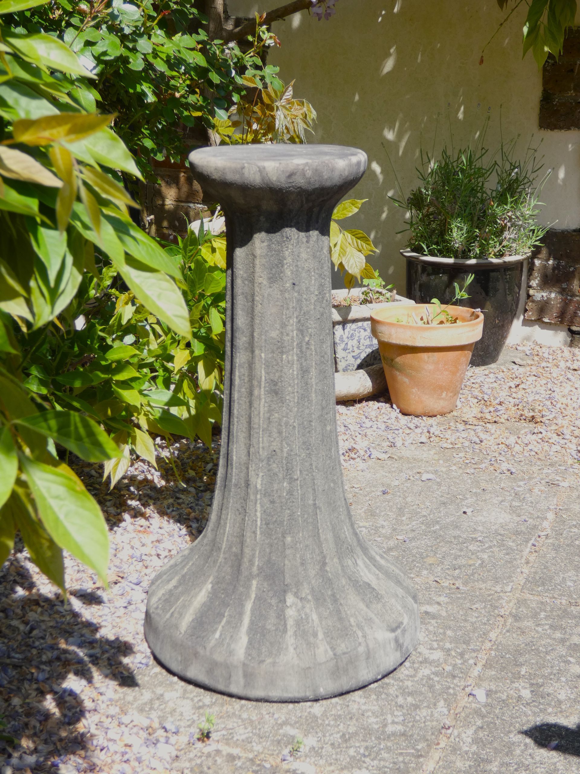 fluted pedestal stone garden statue