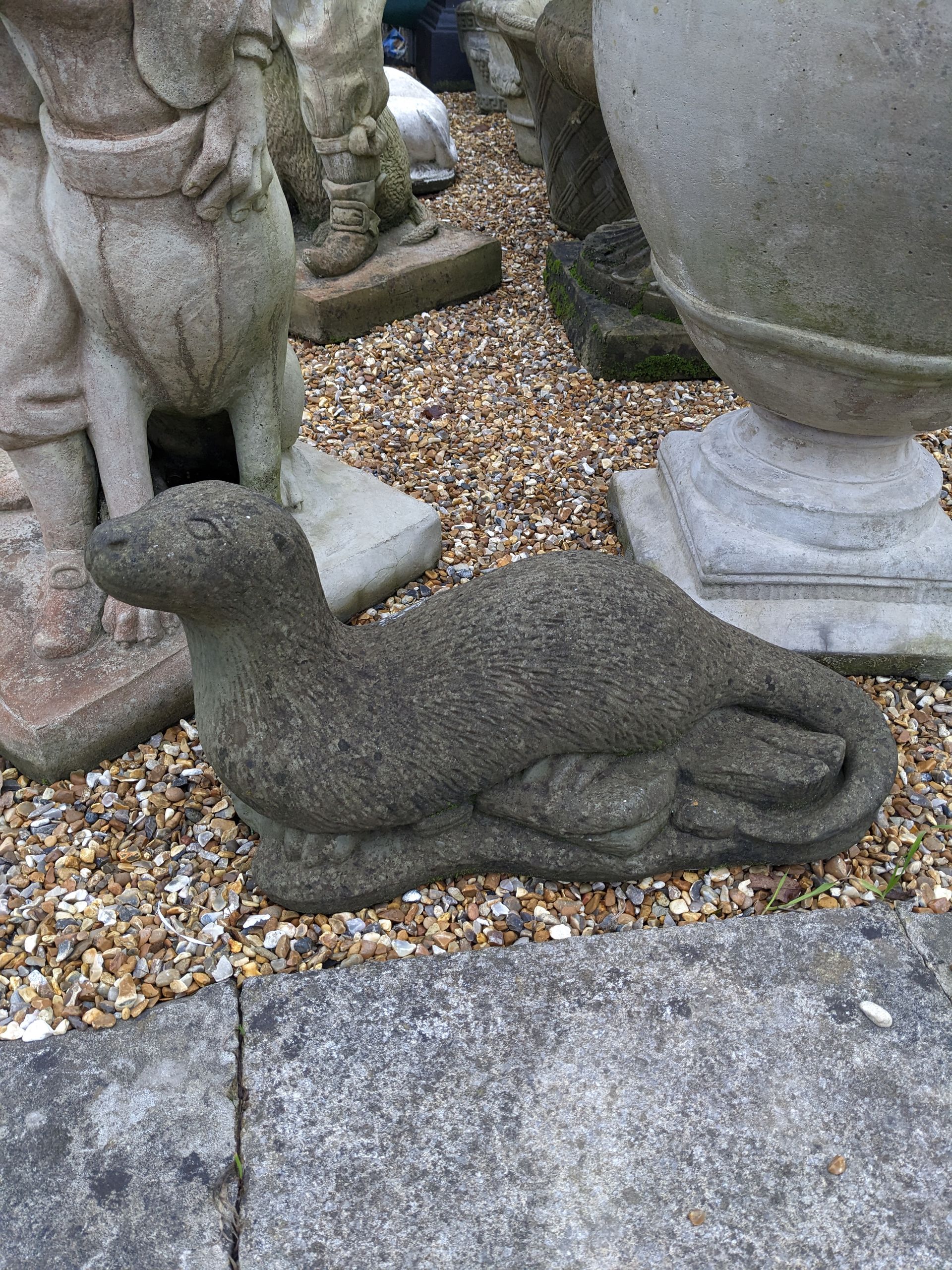 large otter stone garden statue