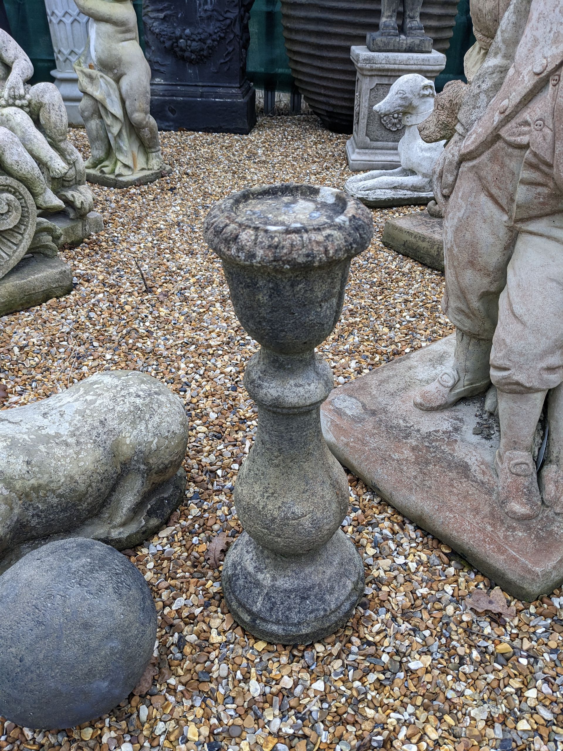 small candlestick stone garden statue