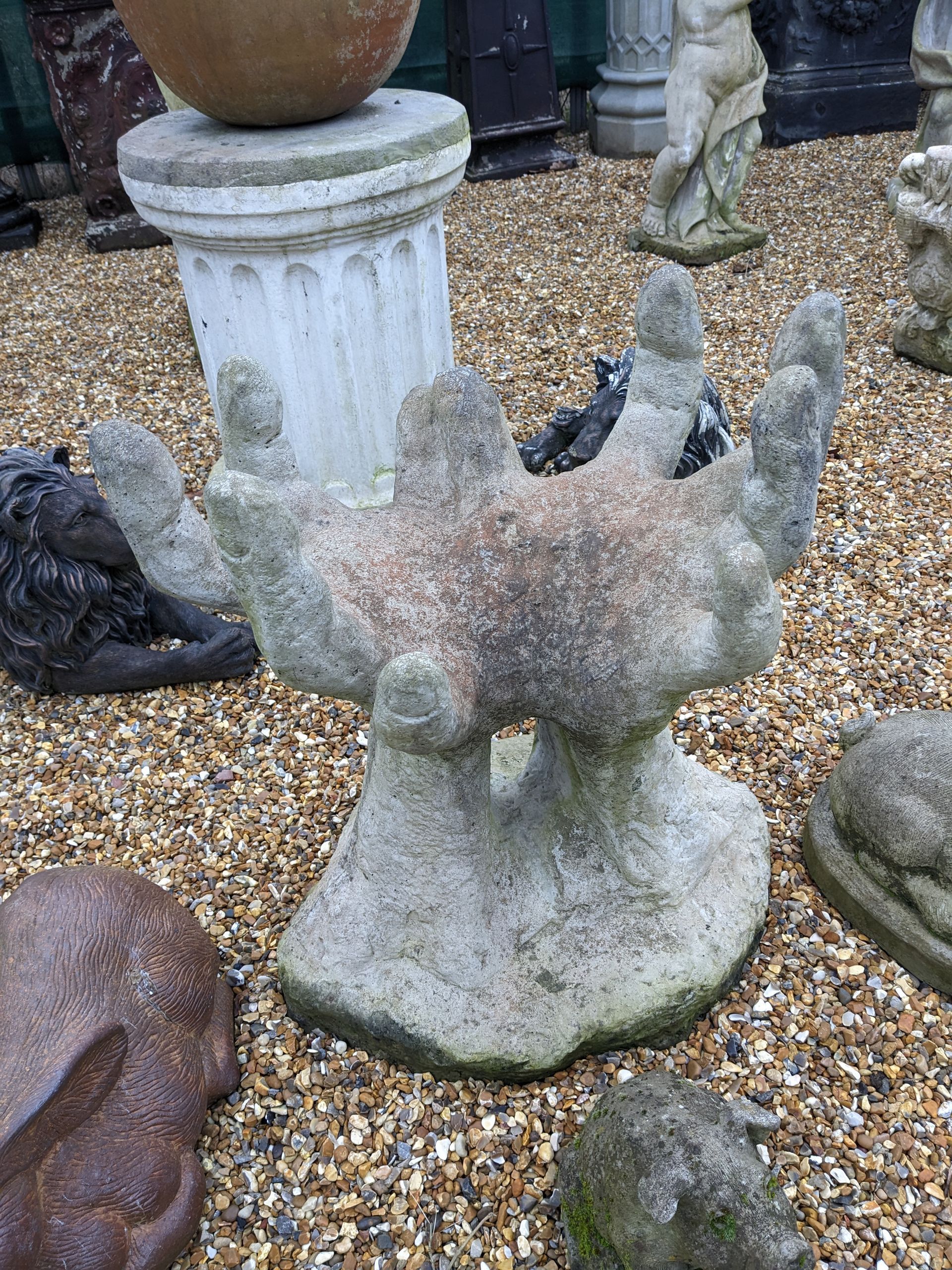 pair of hands stone garden statue