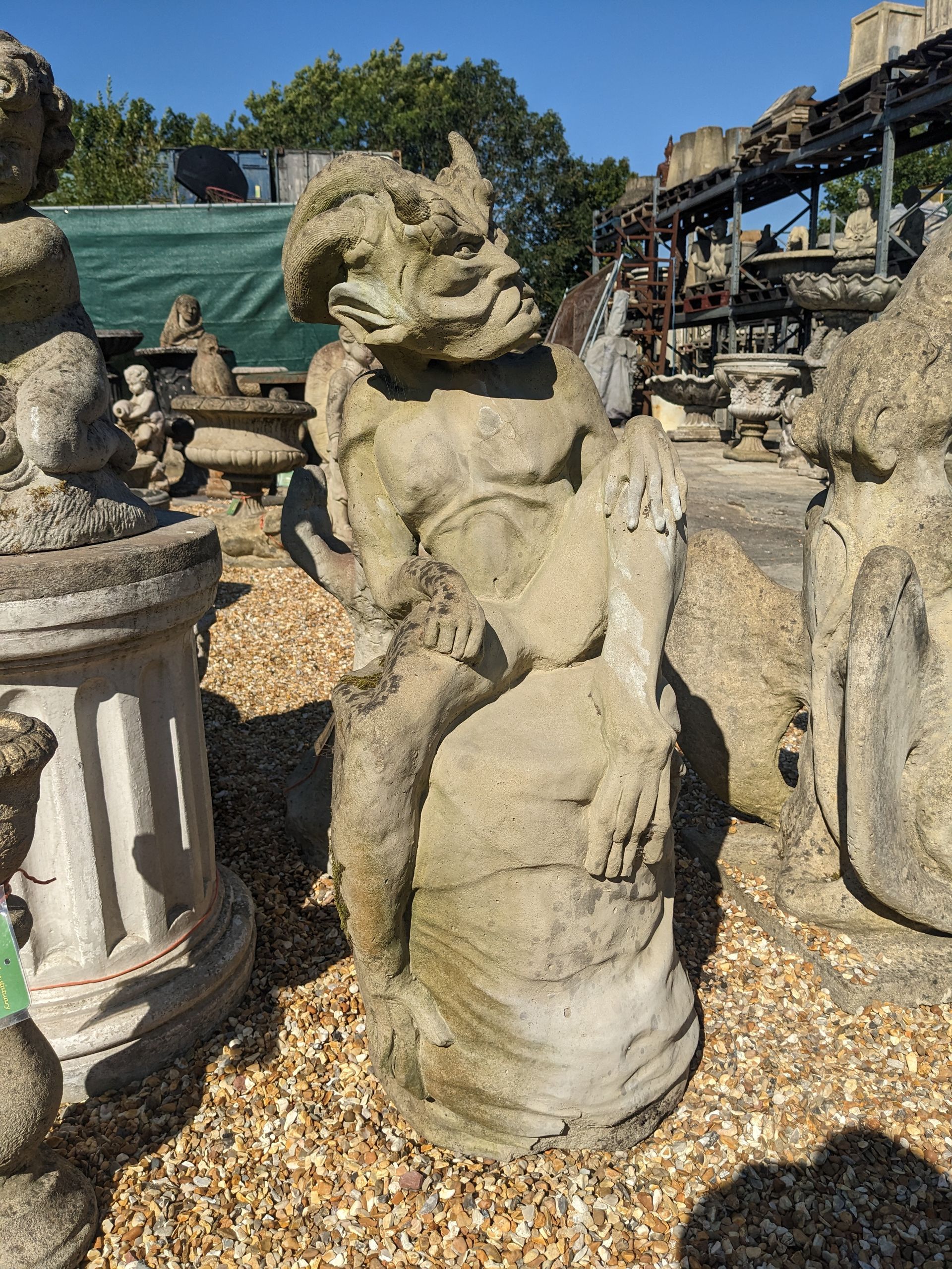 devil demon stone garden statue