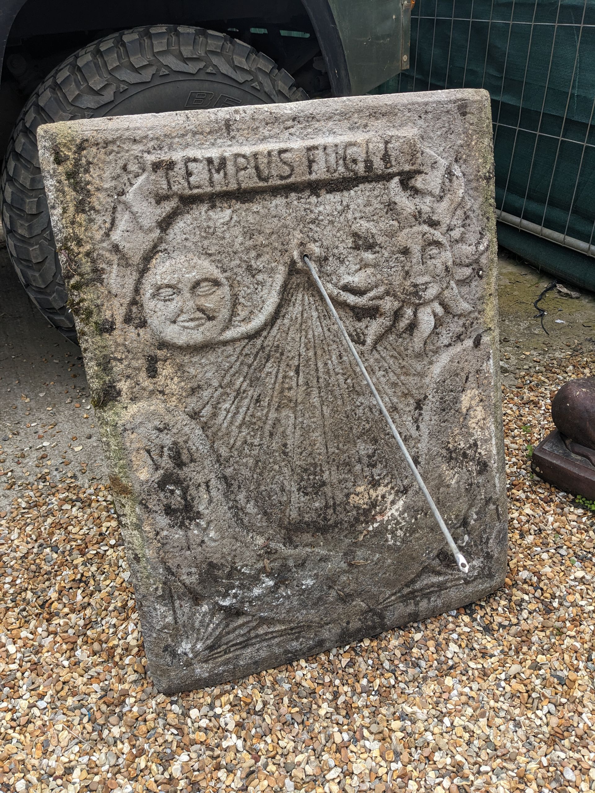 aged wall sundial stone garden statue