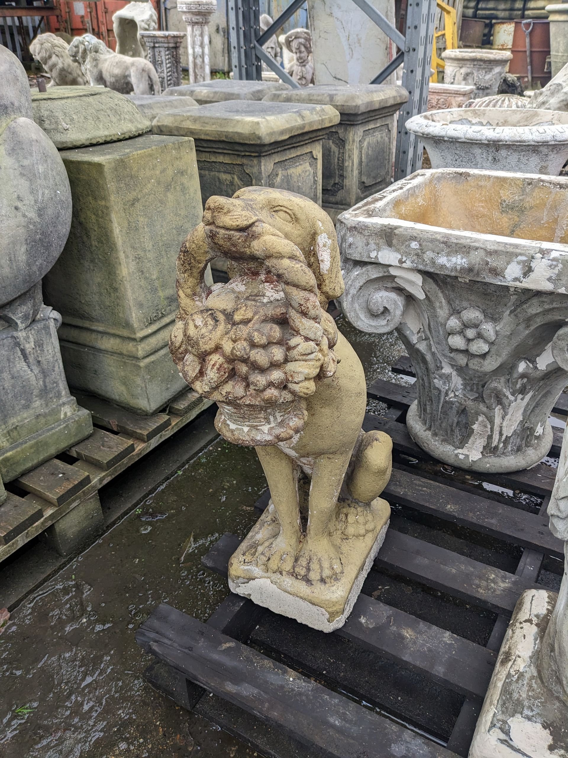 dog with basket stone garden statue