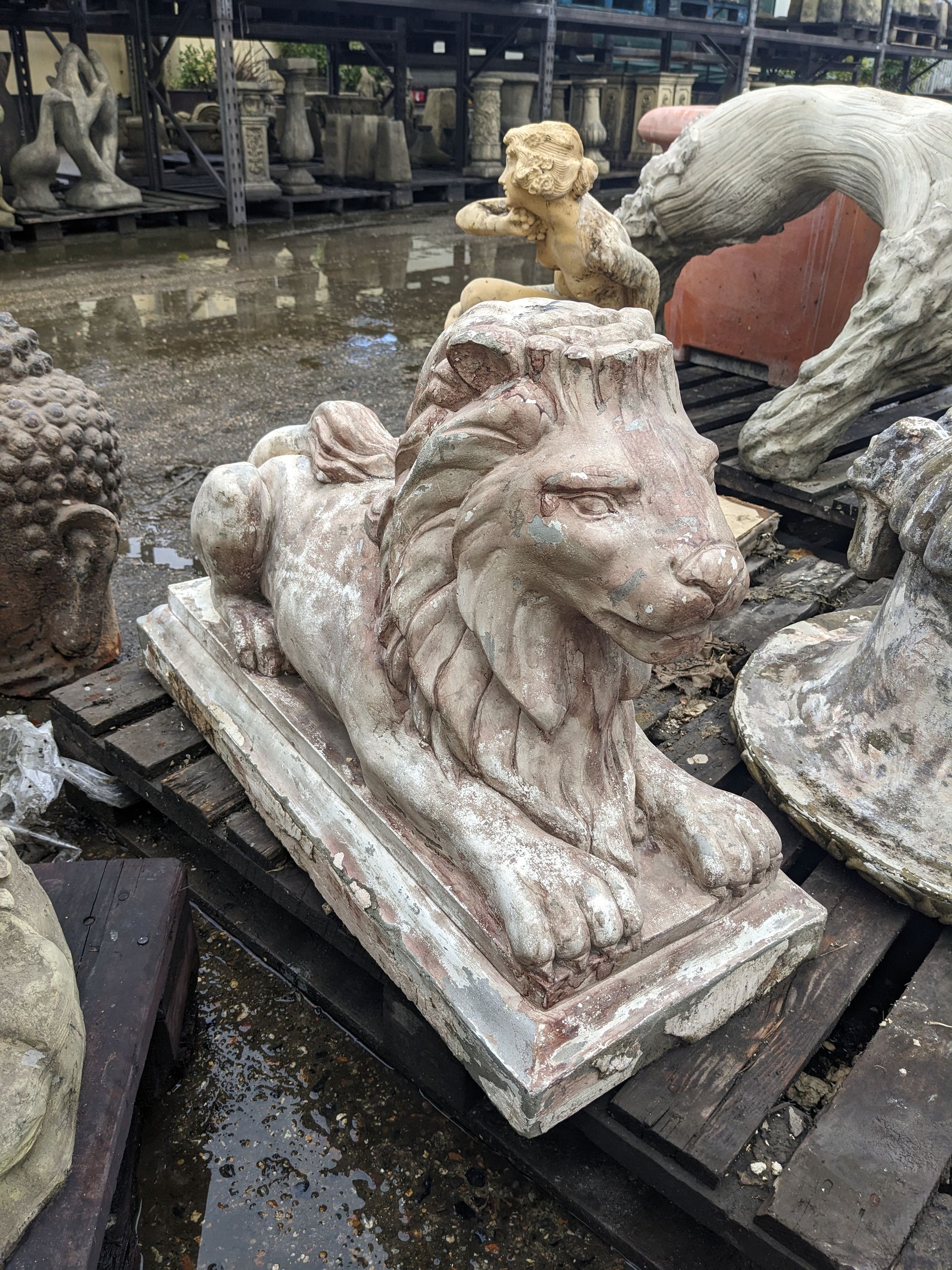large laying lion stone garden statue