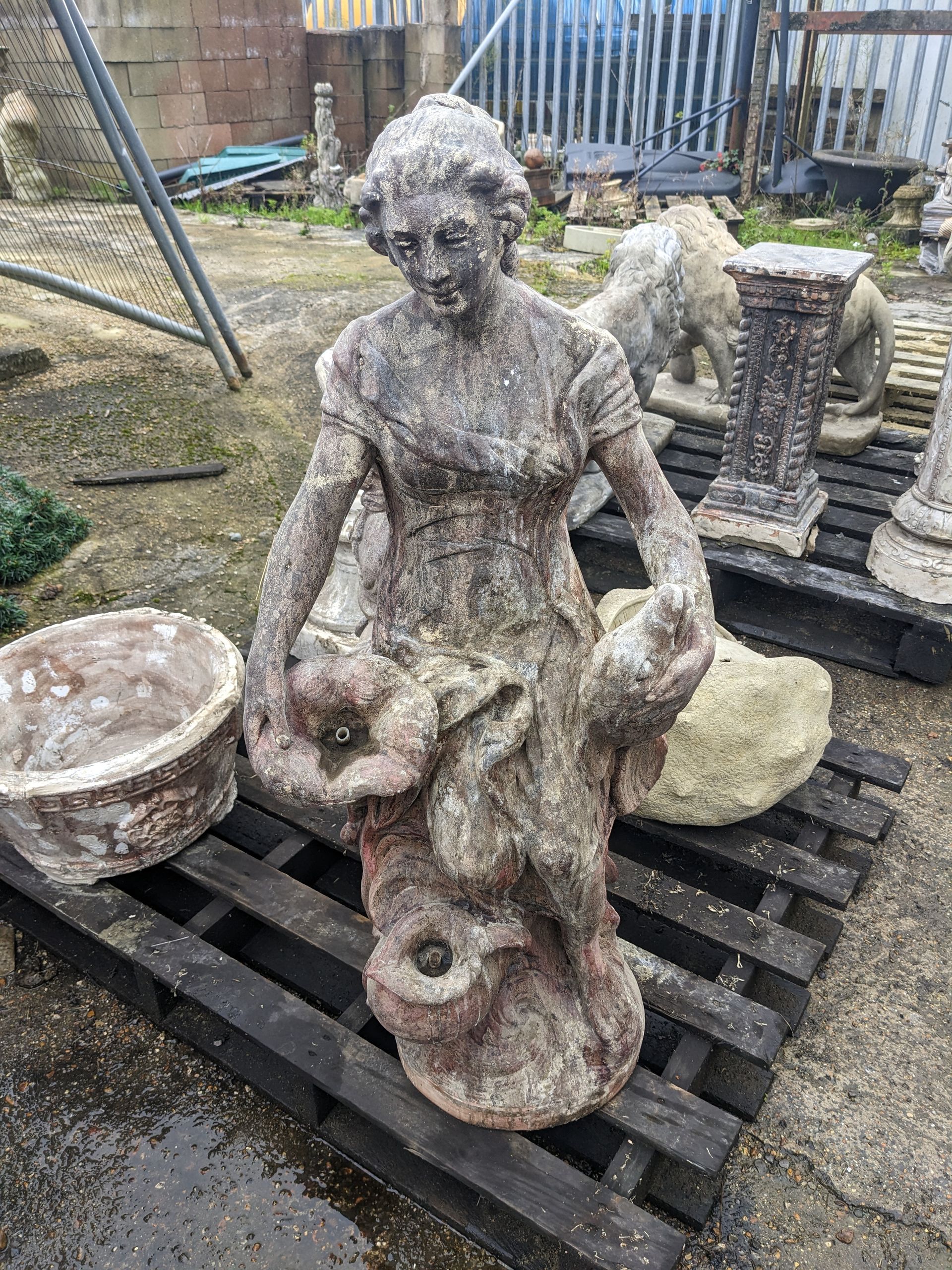 marina fish catch girl stone garden statue