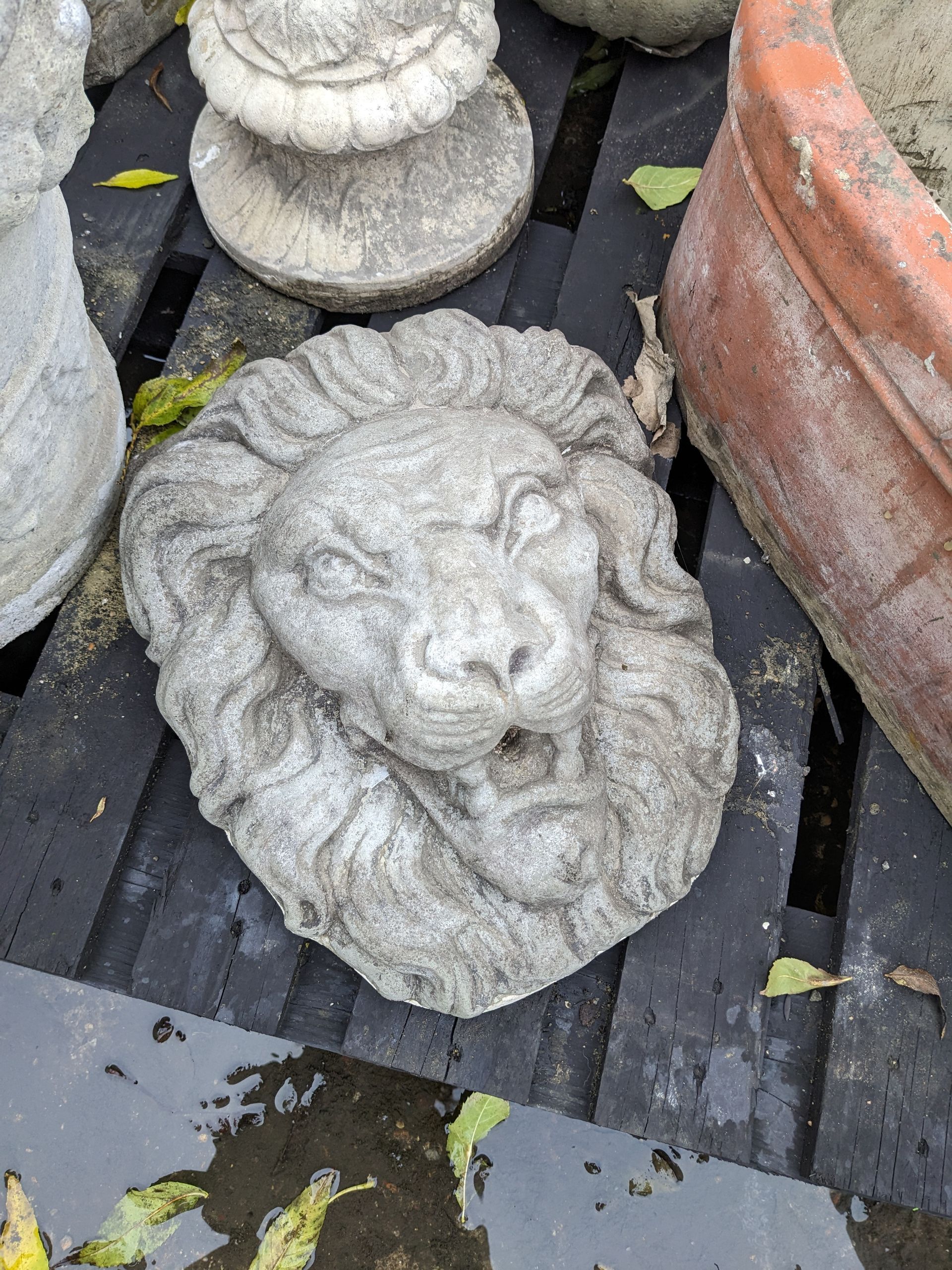 lion head plaque stone garden statue