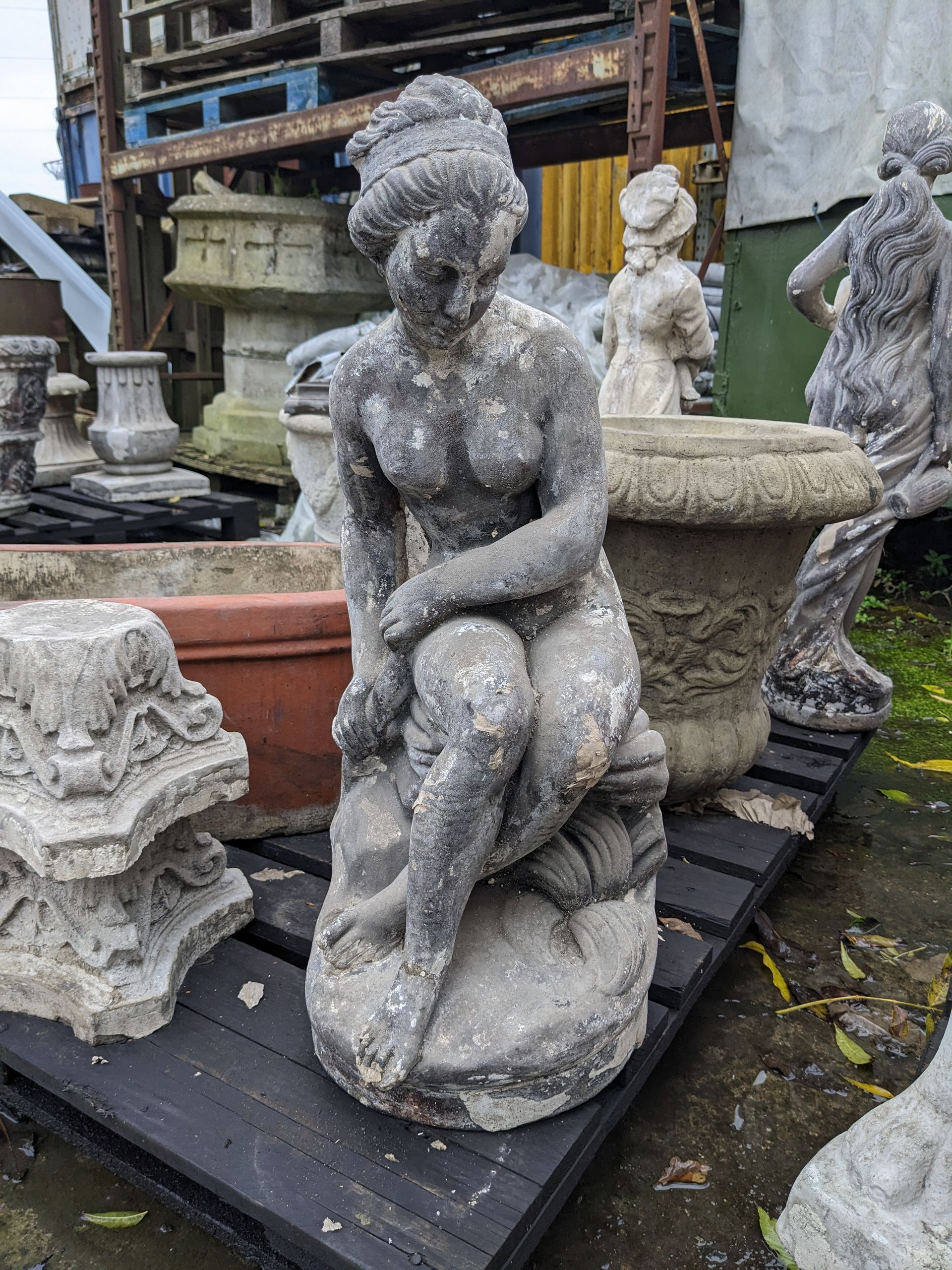 girl on rock stone garden statue