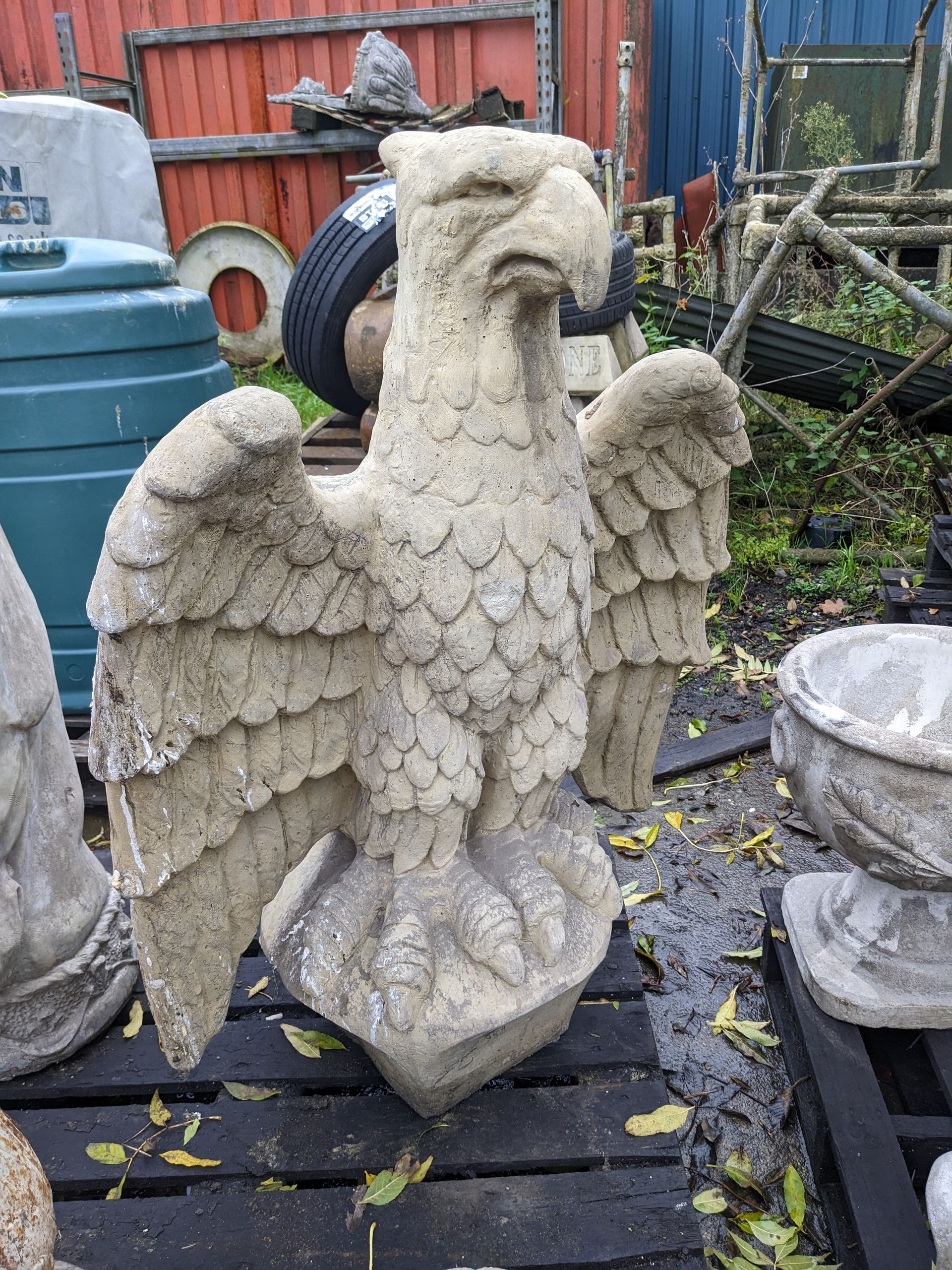 giant golden wings spread eagle stone garden statue