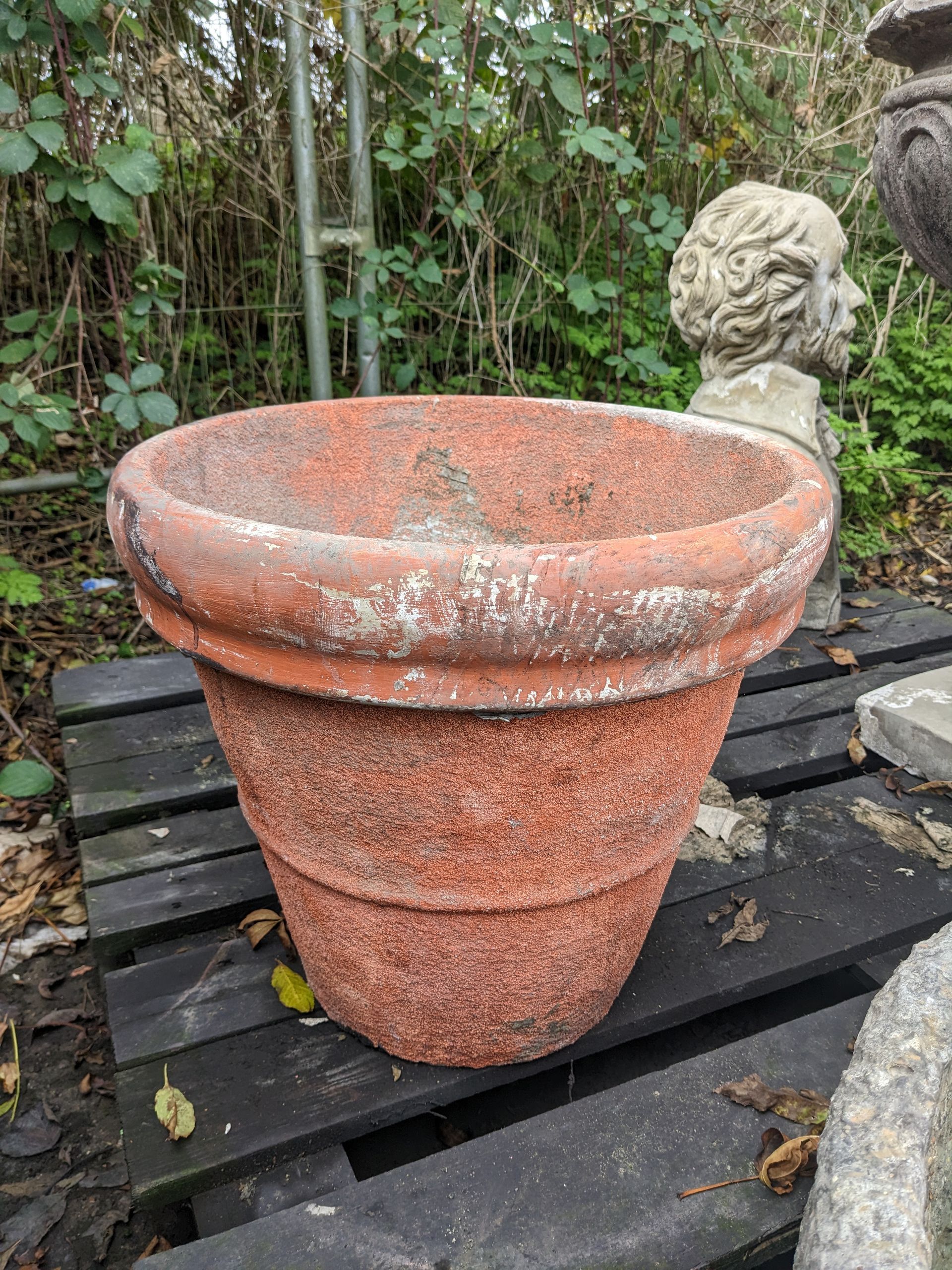 red tub pot vase urn stone garden statue