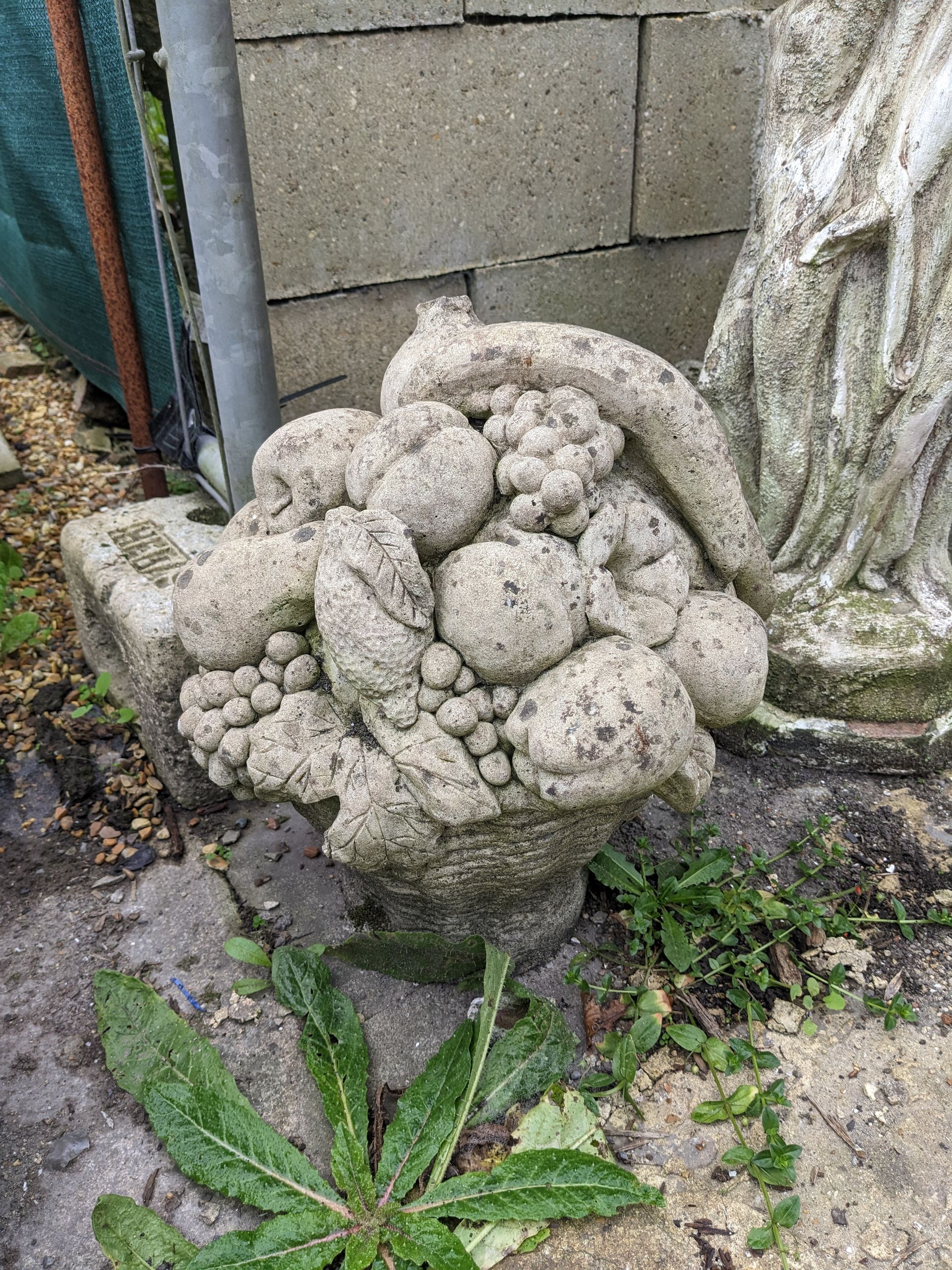 fruit basket stone garden statue
