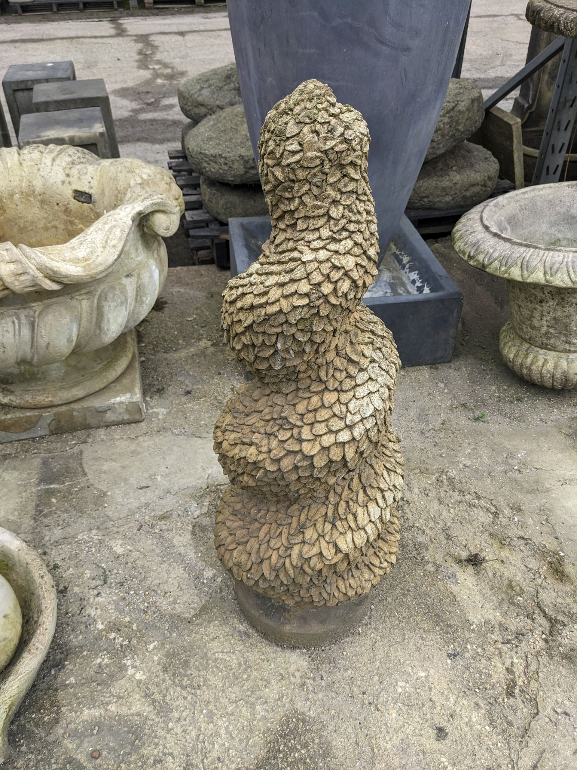 spiral topiary helter skelter stone garden statue