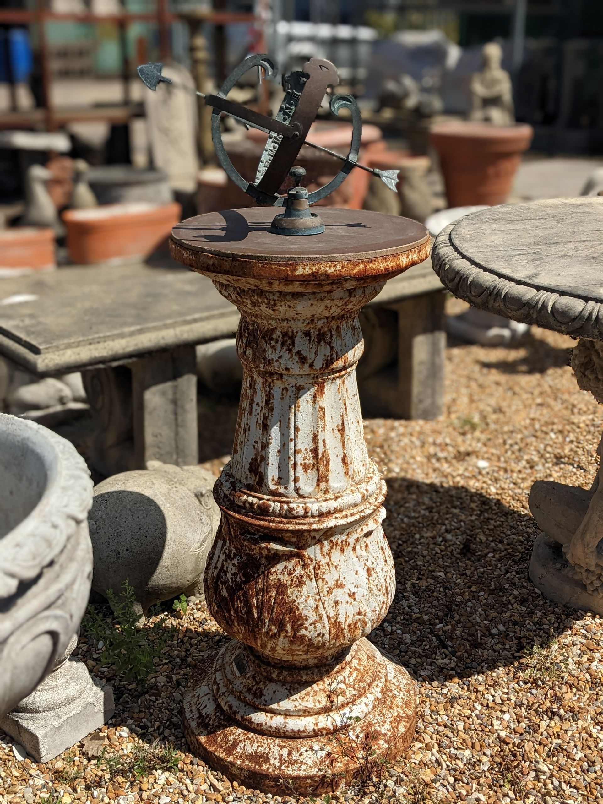 rusty iron grand pedestal with armillary stone garden statue