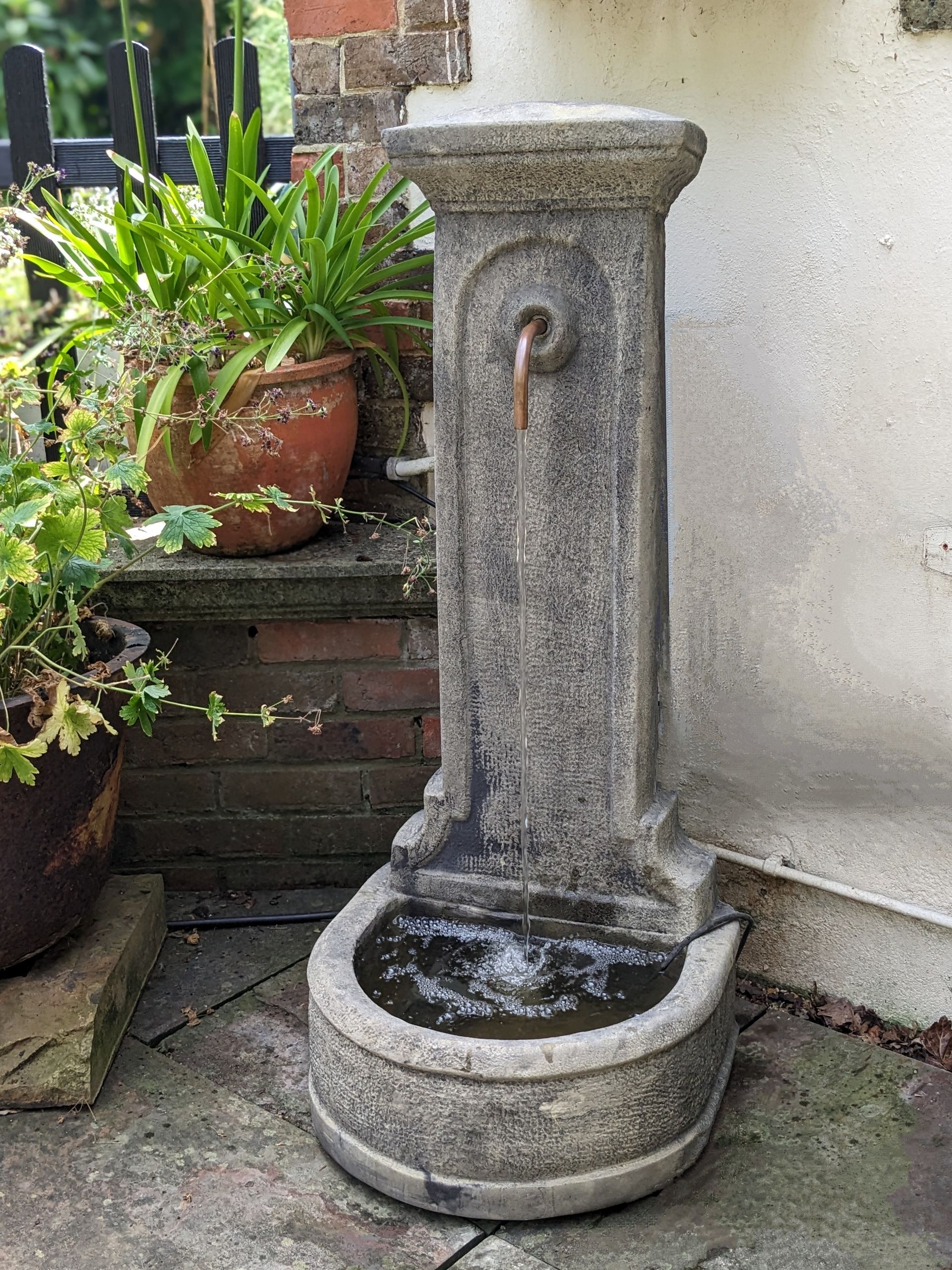 upright fountain copper pipe tap self contained stone garden statue