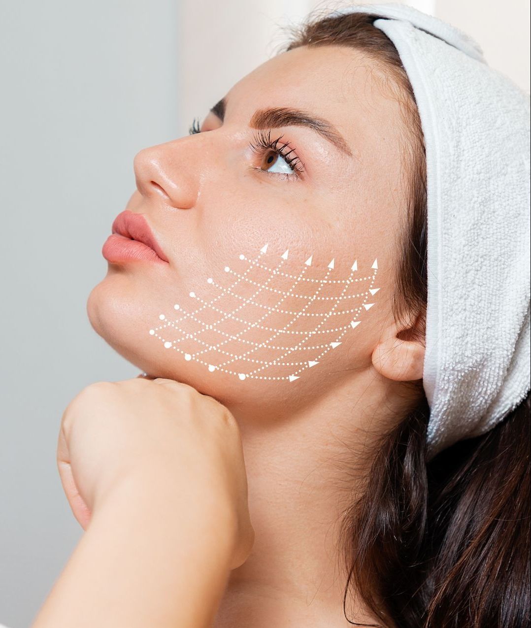 A woman is getting a botox injection in her face.