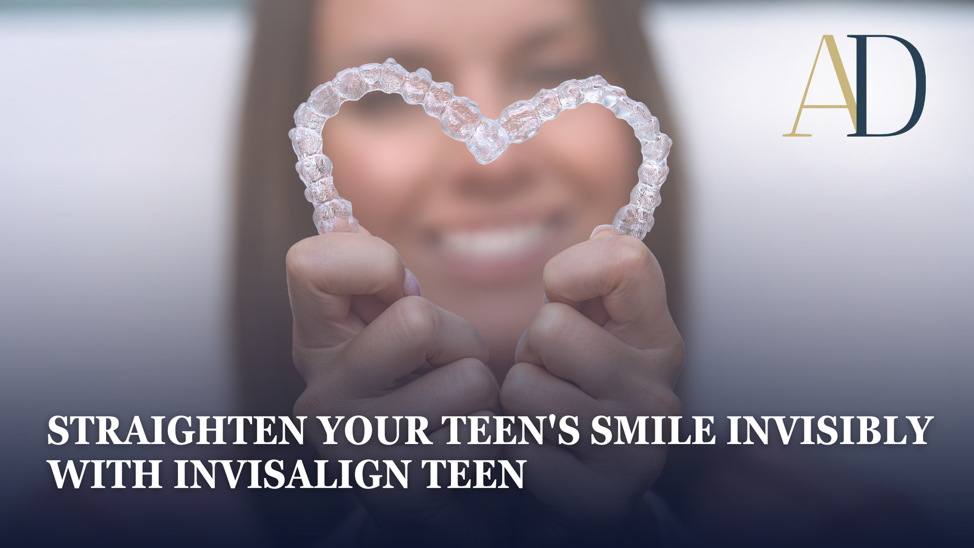 Heart-shaped Invisalign aligner held in front of a smiling face with ad logo and teen smile tagline