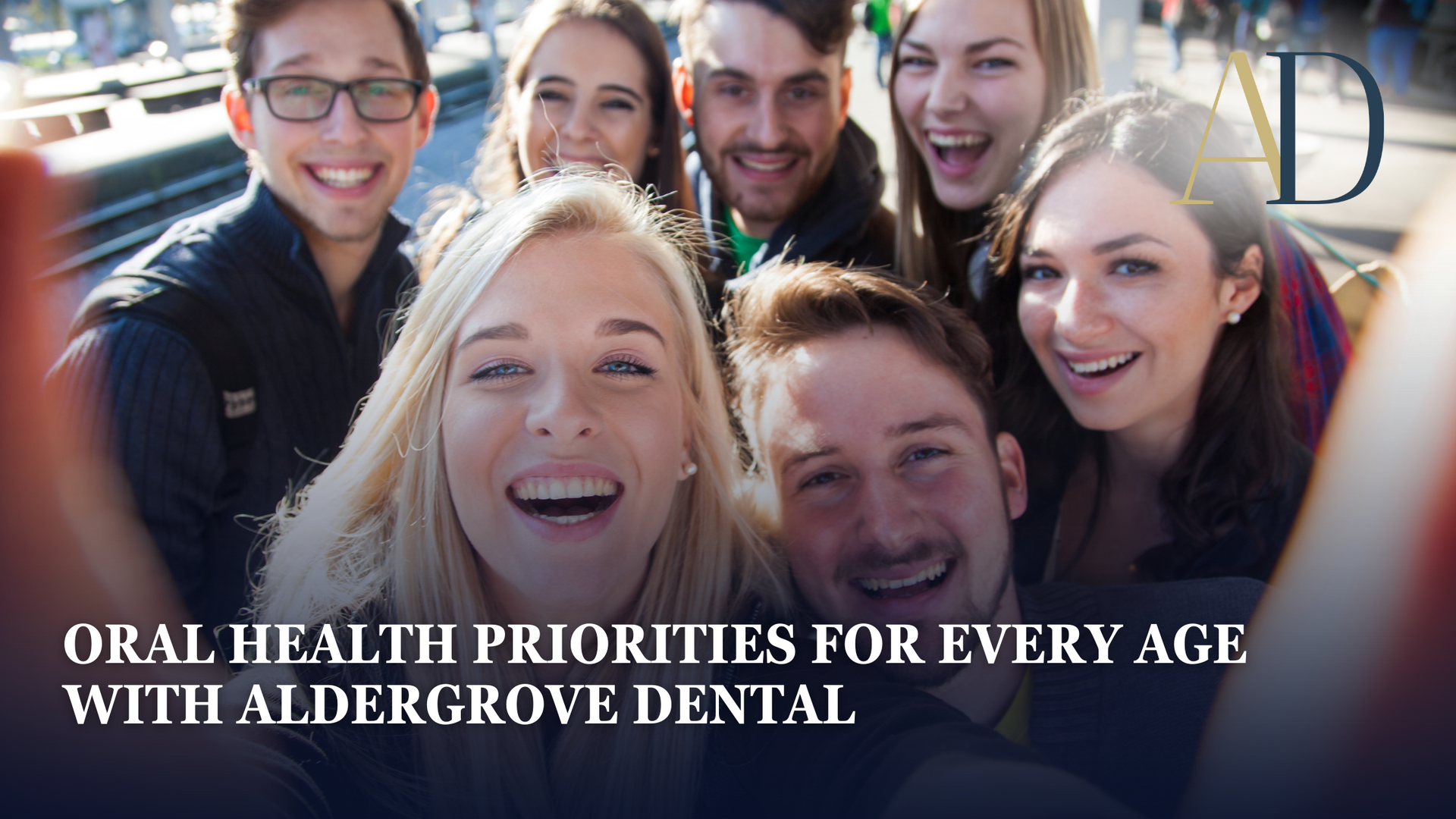 Smiling group in a dental office with text: “Oral health priorities for every age with Aldergrove Dental.”