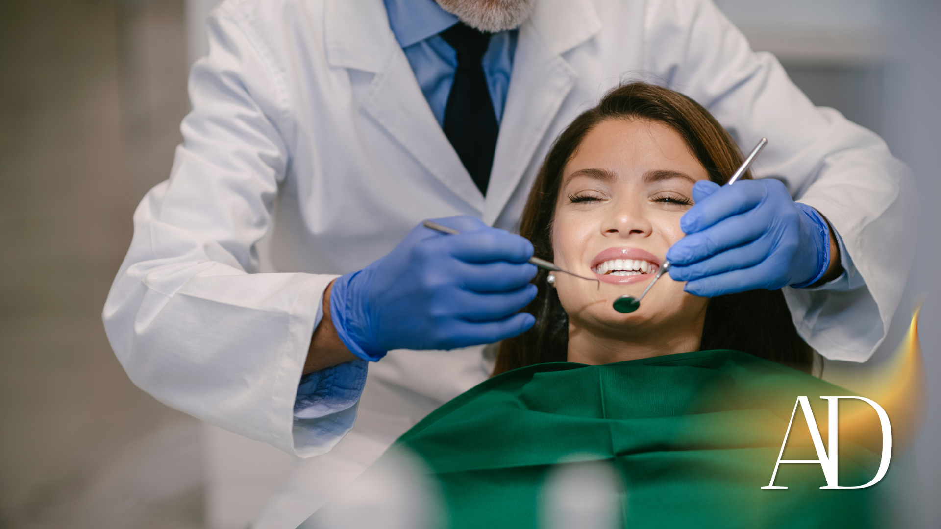 Dentist adjusting braces on a patient in a dental chair, with blue gloves and a green bib.
