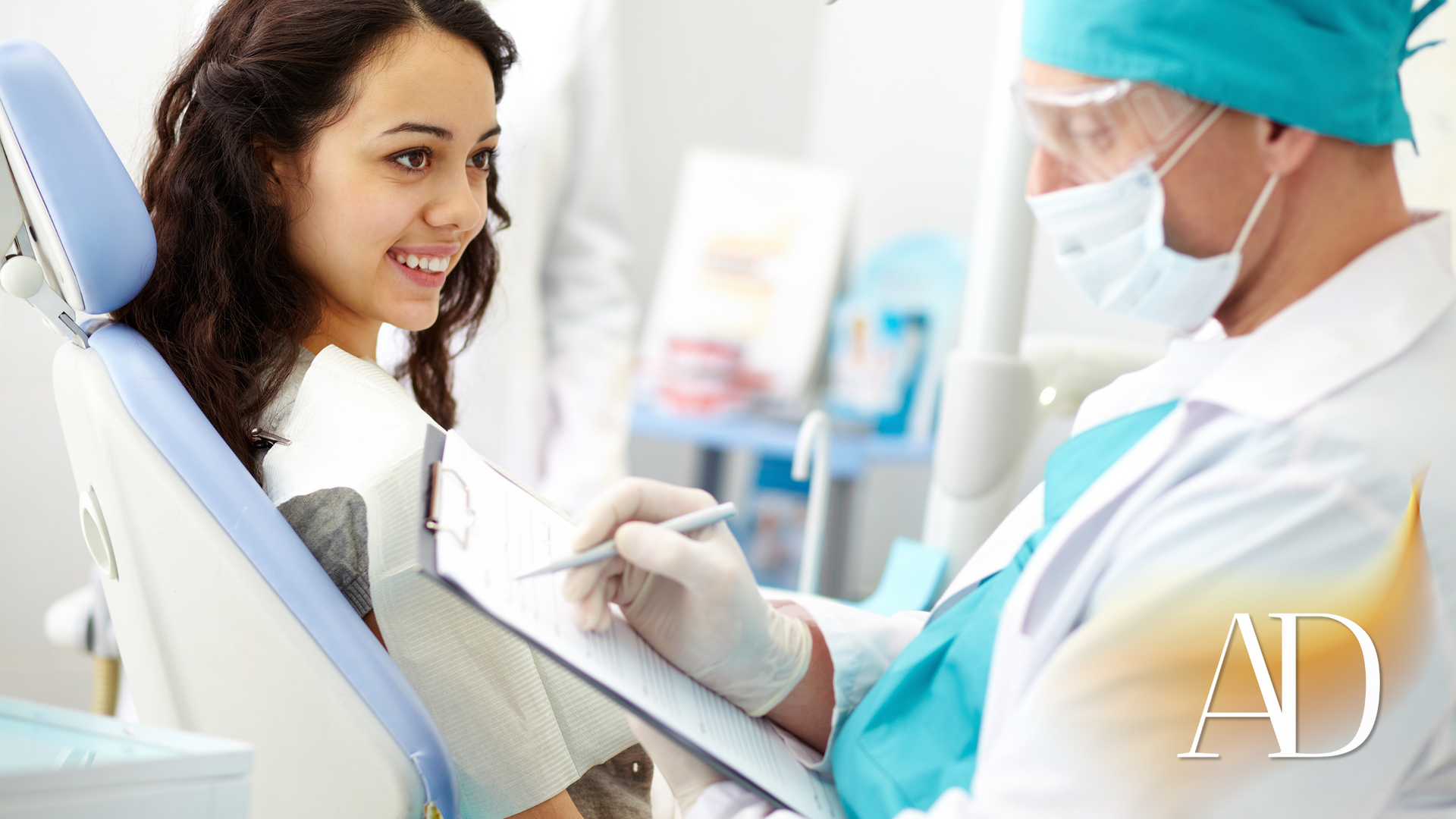 Dentist treating a smiling patient in a bright dental clinic