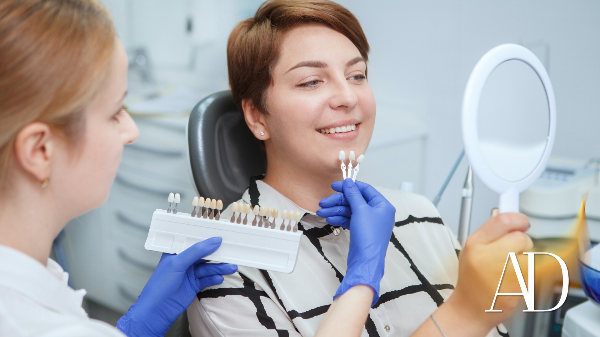 Dentist showing braces to a smiling patient in a bright clinic