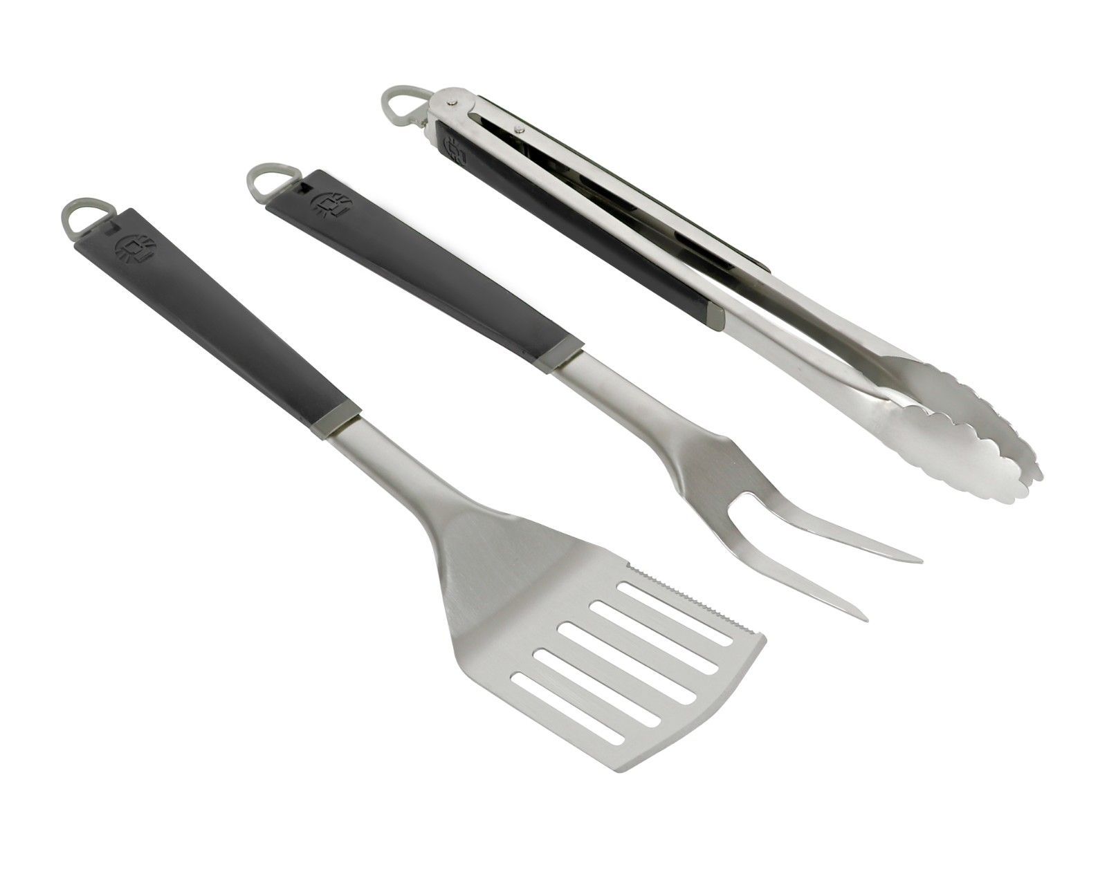 A spatula , fork and tongs on a white background.