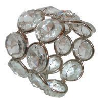 A napkin ring with clear crystals on a white background.