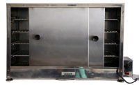A stainless steel oven with sliding doors and shelves on a white background.