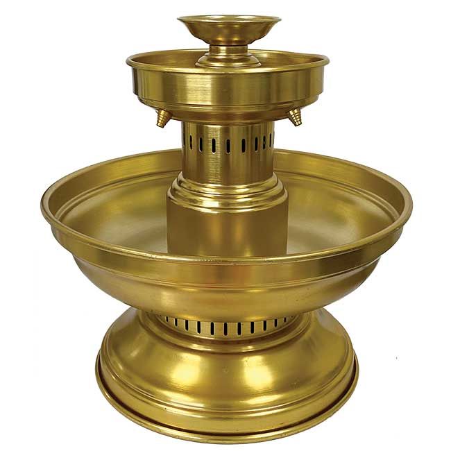 A brass fountain with two bowls and a lid on a white background.