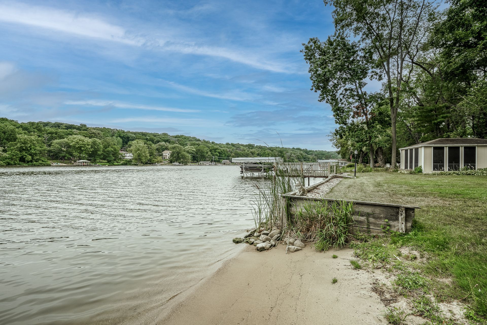 Beach area next to dock of Fox River property sold by Cat Cusimano, realtor