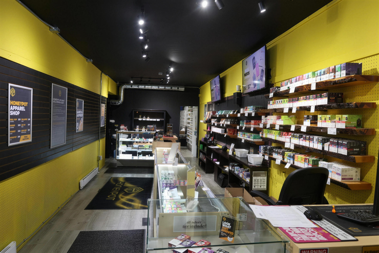 A smartphone app screen displaying a menu of cannabis products including dried flower, pre-rolls, and vapes.