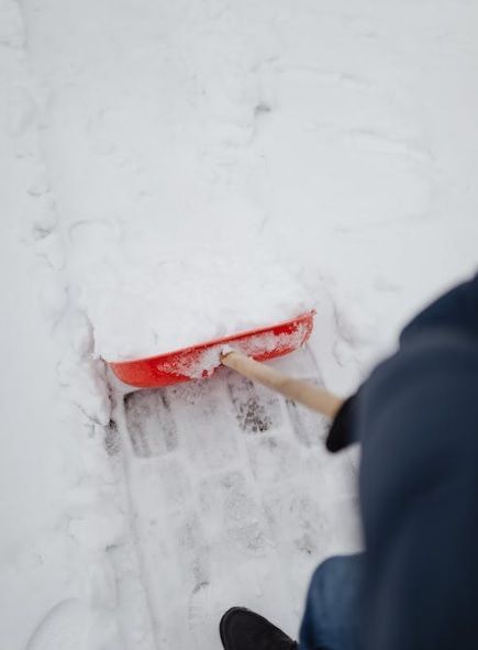 snow shoveling in driveway