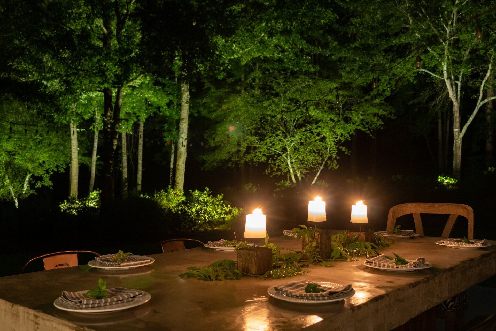 Candlelit outdoor dining table