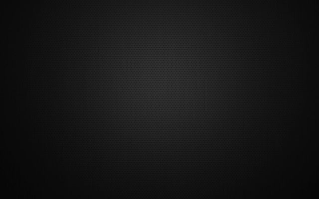 Dark textured black background with a subtle spotlight glow in the center