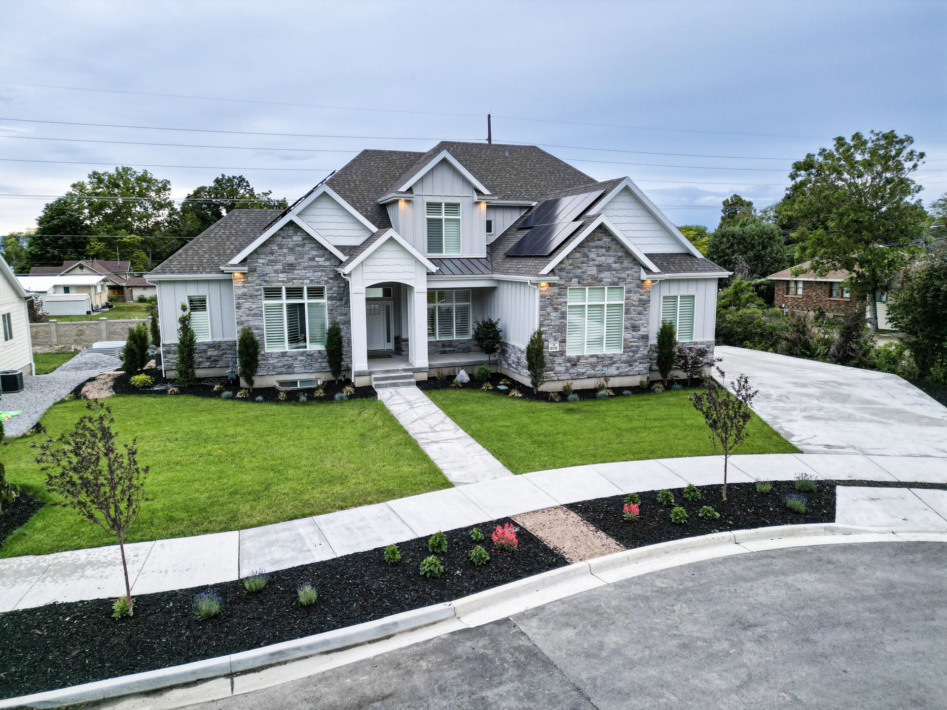 House with green lawn and flower.