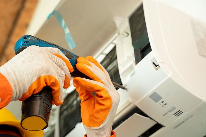 Fixing Air Conditioner — Chatham, NY — Welch Mechanical