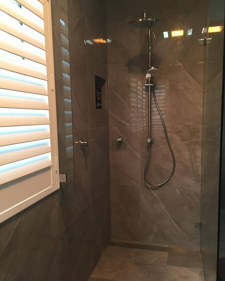 A Bathroom with A Walk in Shower and A Window — Bowral Bathrooms in Mittagong, NSW