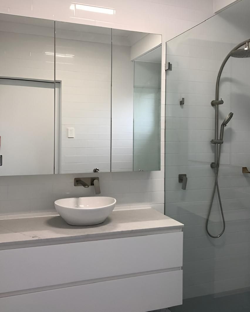 A Bathroom with A Sink a Mirror and A Shower — Bowral Bathrooms in Exeter, NSW