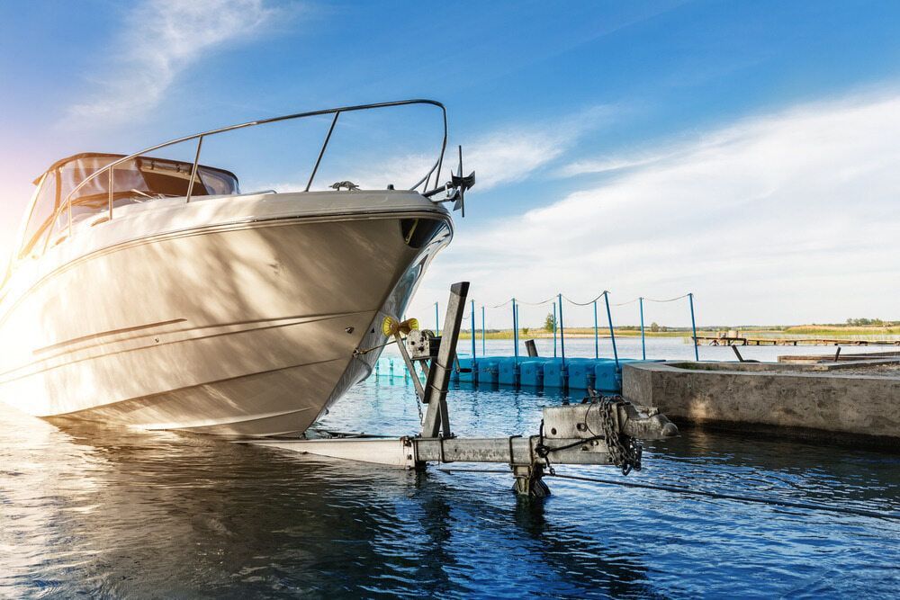 Boat is Being Towed by a Trailer in the Water — 365 Towing Taree in Bulahdelah, NSW
