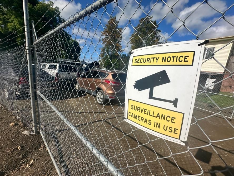 Security Notice Sign on a Chain Link Fence — 365 Towing Taree in Oldbar, NSW