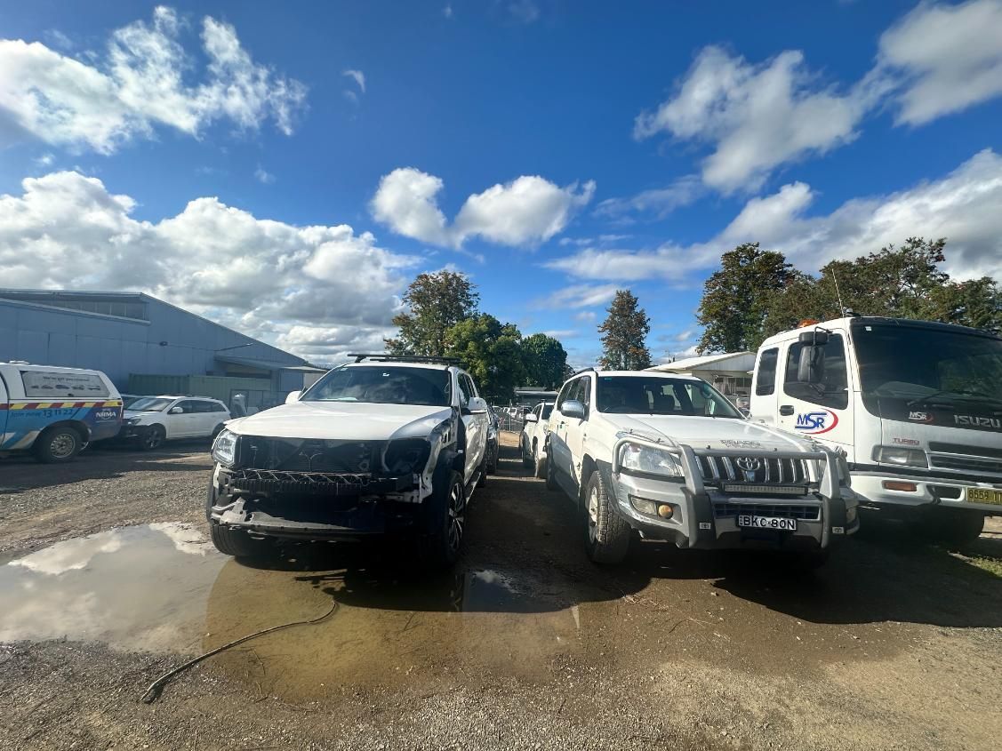 Row of Trucks Are Parked in a Parking Lot — 365 Towing Taree in Harrington, NSW