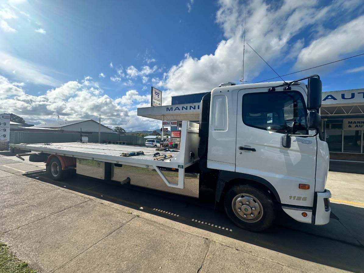 White Tow Truck is Parked on the Side of the Road — 365 Towing Taree in Oldbar, NSW