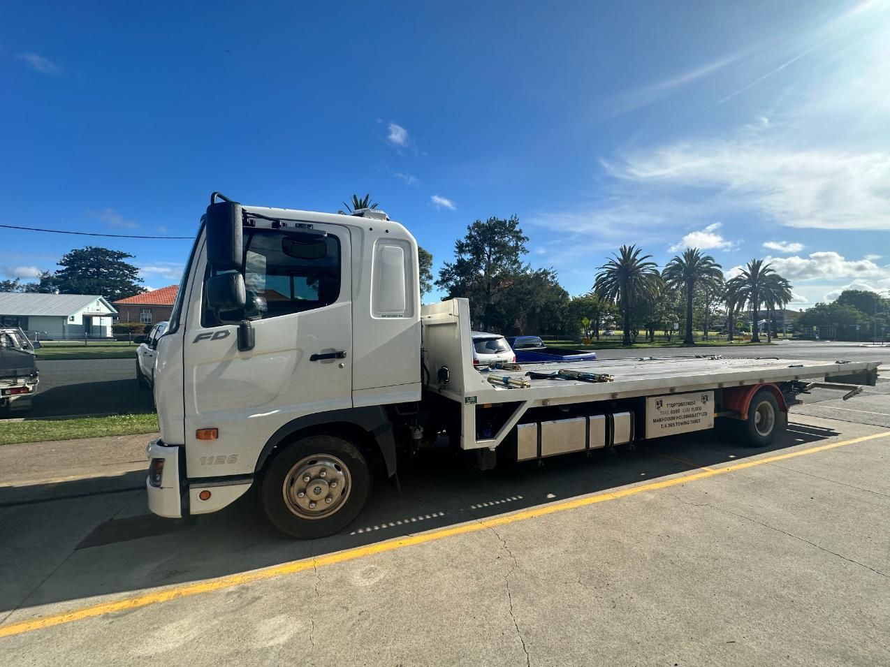 White Tow Truck is Parked on the Side of the Road — 365 Towing Taree in Harrington, NSWW