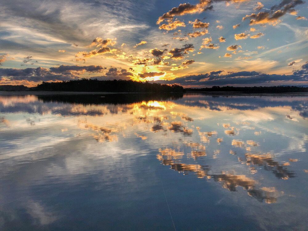 Sunset Over a Lake With Clouds Reflected in the Water — 365 Towing Taree in Oldbar, NSW