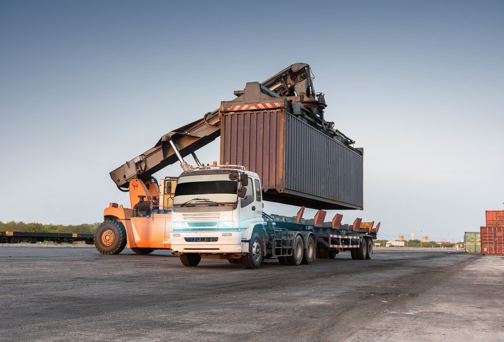 Truck is Being Loaded With a Container in a Warehouse — 365 Towing Taree in Forster, NSW