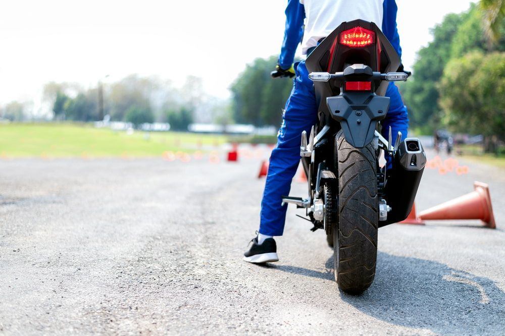 Person is Standing Next to a Motorcycle on a Road — 365 Towing Taree in Forster, NSW