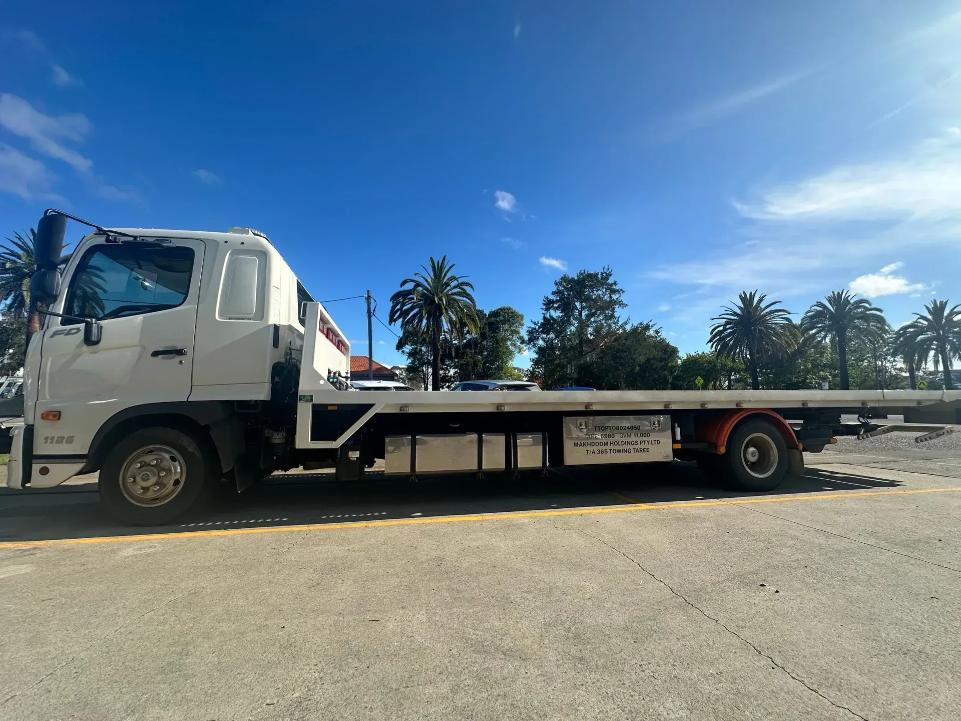 Tow Truck is Towing a Car on the Side of the Road at Night — 365 Towing Taree in Wingham, NSW