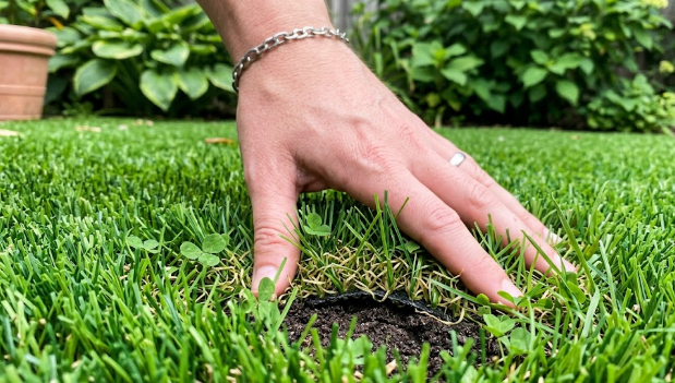Close up view of premium synthetic grass blades showing realistic textures and colors.