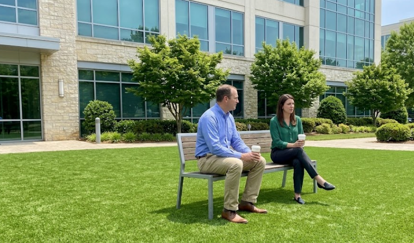Modern office building in Raleigh with bright green commercial artificial turf in the courtyard.