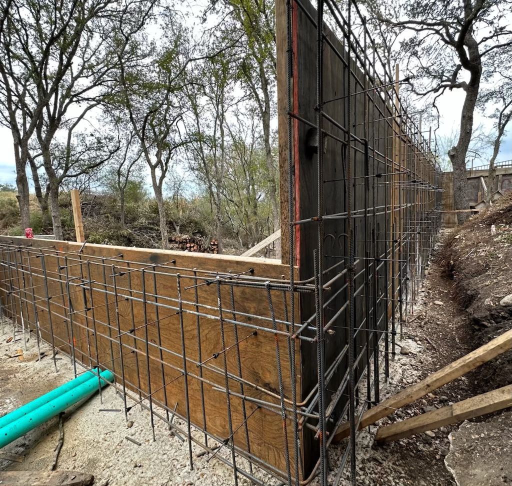 A wall is being built in the middle of a forest.
