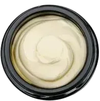 Top view of a jar of cream with a smooth white swirl